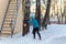 The girl participates in winter orienteering training in urban conditions