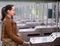 Girl passing ticket barrier in subway