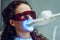 Girl patient in the dental clinic. Teeth whitening UV lamp with photopolymer composition