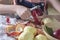 Girl peeling apples that she picked from the garden