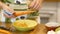 Girl peeling carrots for salads