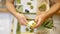 Girl peeling peppers for salads