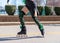 Girl performing Irish dance on roller blades in St. Patrick`s Day parade