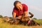 Girl pets her boxer dog