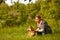 Girl petting a dog Shiba Inu.