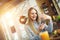 Girl with a phone in her hands resting in a trendy cafe with Christmas decorations