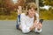 Girl with phone lies on the road makes selfie