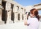 Girl is photographing an ancient statues in Karnak