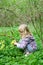 Girl picking cowslip flower