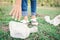 Girl picking garbage in park