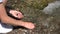 Girl Picking River Stone by Mountain Waterfall, Tourist Kid Playing in Water, Child Hands in Spring Stream Hiking at Camping Trip