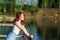 Girl at the pier. looking into the distance. redhead in sunglasses. pensive girl