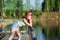 Girl at the pier. looking into the distance. redhead in sunglasses. pensive girl