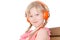 Girl with pigtails listening language lessons in headphones isolated