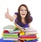 Girl with pile book showing thumb up.
