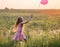 Girl with pink balloon outdoor