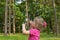 The girl in a pink blouse releases bubble