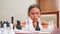 Girl in pink frame glasses plays chess