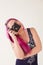 Girl with pink hair photographs camera