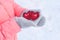Girl in pink jacket holding red heart 3d illustration, 3d rendering model, symbol of love, gray woolen mittens in hands, winter
