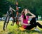 Girl in pink sportswear with a Bicycle resting and relax