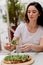 Girl with pinsa romana in cafe on summer terrace. Young woman eating pinsa and drinking wine