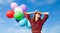 Girl in plaid dress with multicolored balloons