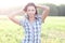 Girl in plaid shirt summer meadow, concept the idea of happiness brunette rest nature