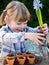 Girl planting flower bulbs