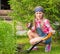 Girl planting plants in the garden