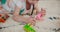 Girl, play and dinosaur toys on floor with animals in game, fight or kid relax in living room or home. Child, smile and