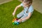 Girl play with whirligig colourful musical bells