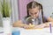 Girl play with yellow slime inflates bubble fun at home