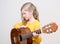 Girl playing acustic guitar