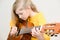 Girl playing acustic guitar