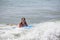 A girl playing with a bodyboard