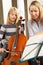 Girl playing cello in music lesson