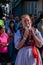 Girl playing clarinet in festive procession