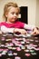 Girl playing with jigsaw puzzle