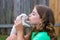 Girl playing kissing puppy chihuahua pet dog