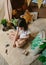 Girl playing observing toy bugs with a magnifying glass