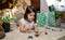 Girl playing observing toy bugs with a magnifying glass