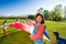 Girl playing parachute game on the green field