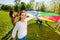 Girl playing parachute together with her friends