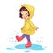 Girl playing in a rain puddle