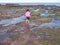 Girl playing in rock pools