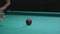 Girl playing Russian billiards. Close-up of a hand