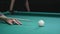 Girl playing Russian billiards. Close-up of a hand