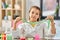 Girl playing with slime at home laboratory