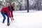 Girl playing with snow. Beautiful young woman in winter.  Happy woman holds snowball in hands